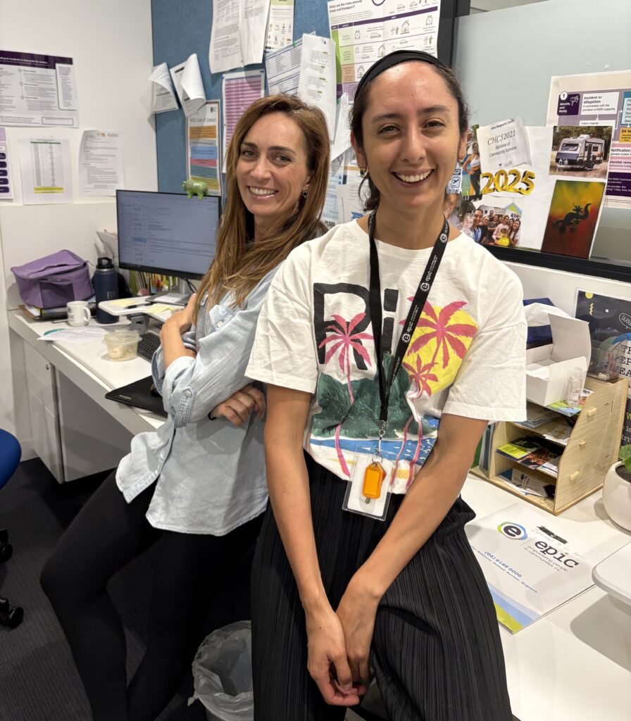 Two happy staff members